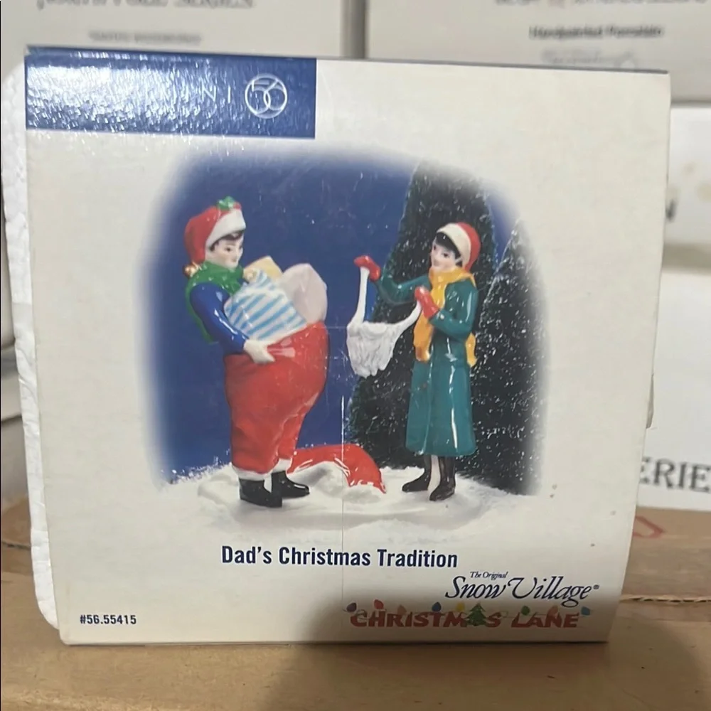 Department 56 Snow Village Christmas Lane Figurine. Dads Christmas tradition